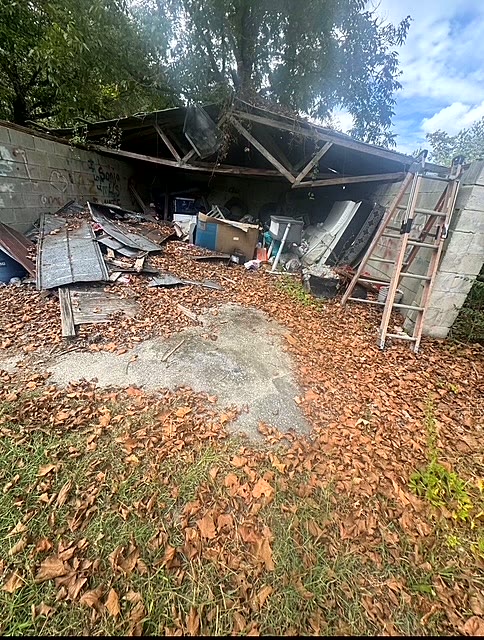 Property before carport debris and junk removal